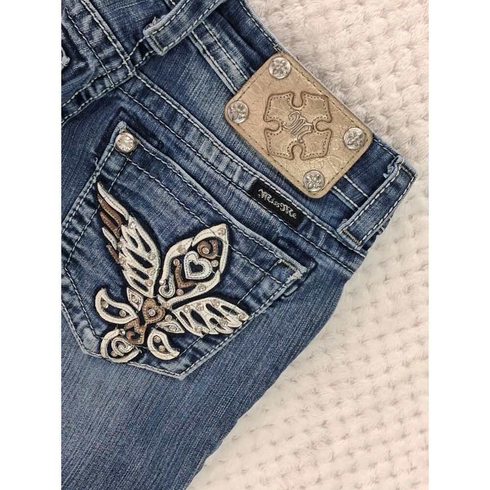 Miss Me Women's 25 Skinny Medium Wash Low Rise Fleur-de-Lis Wing Jeans